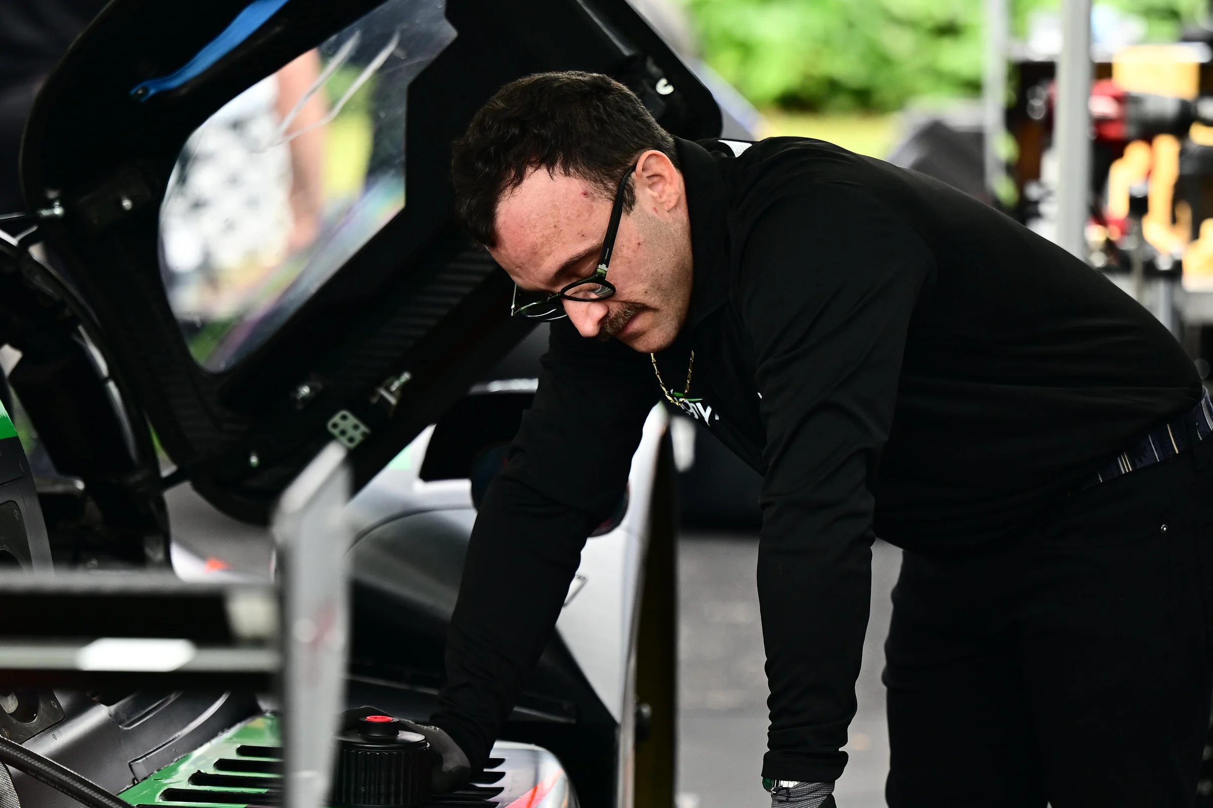 A Forbush Performance crew member preparing the No. 18 cockpit at Road Atlanta